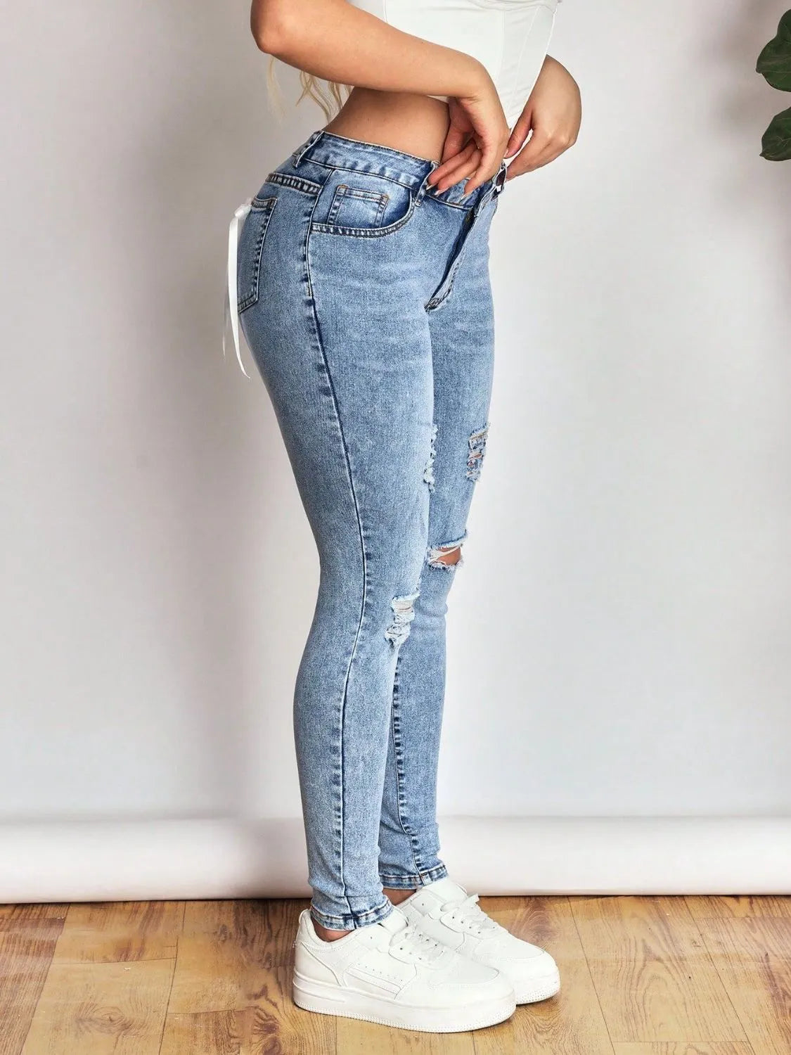 Distressed Skinny Jeans with Bow Back - Thalia Chic